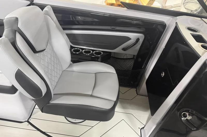 Slide: The Image of 2026 Yamaha Boats 255XD interior with sleek seating and modern design. - 6