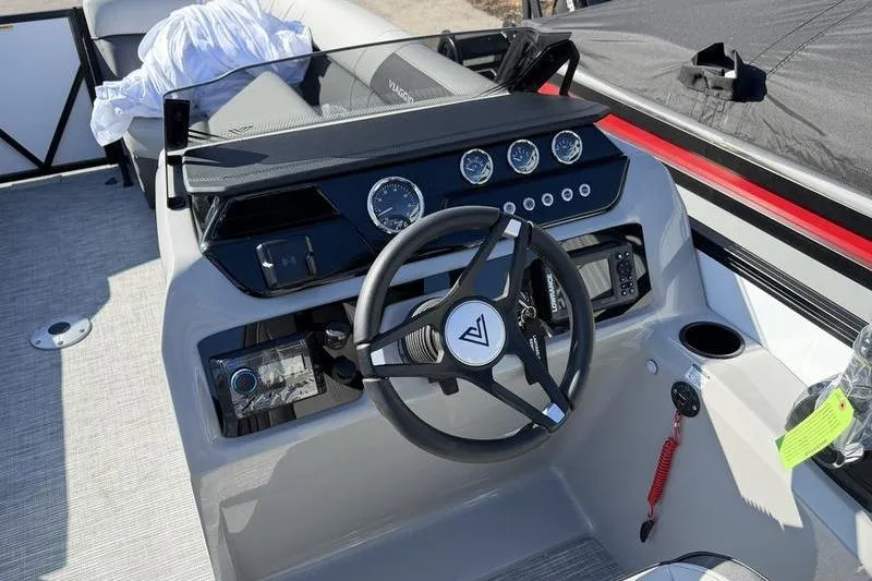 Slide: The Image of Steering console of 2026 Viaggio Lago V22S boat with modern controls and gauges. - 10