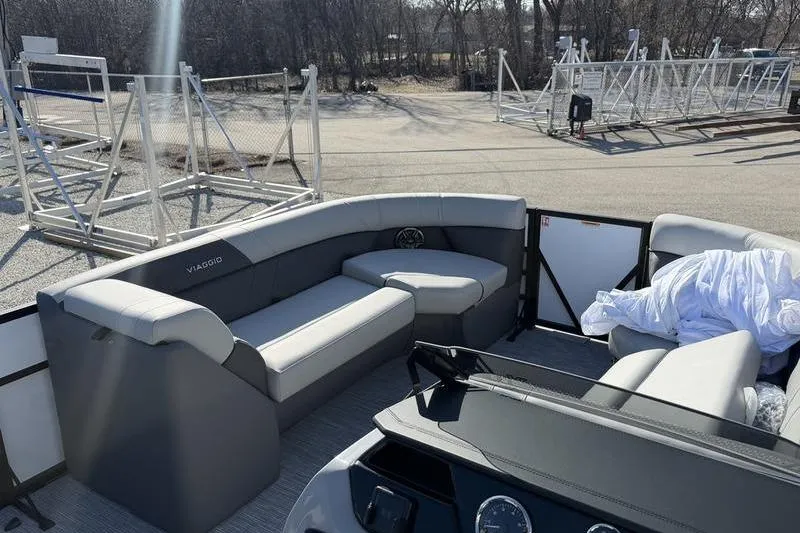 Slide: The Image of Interior of 2026 Viaggio Lago V22S pontoon boat with gray seating and helm. - 11