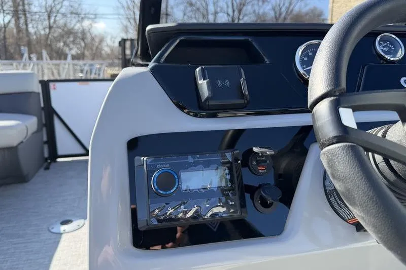 Slide: The Image of 2026 Viaggio Lago V22S boat dashboard with modern controls and steering wheel. - 6