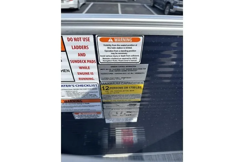 The Image of 2022 Bennington LPD pontoon boat on trailer at Boat Masters Marine dealership. - 1