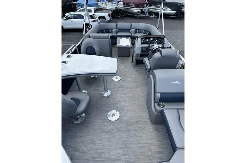 Slide: The Image of 2022 Bennington LPD boat interior with gray seating and steering console. - 15