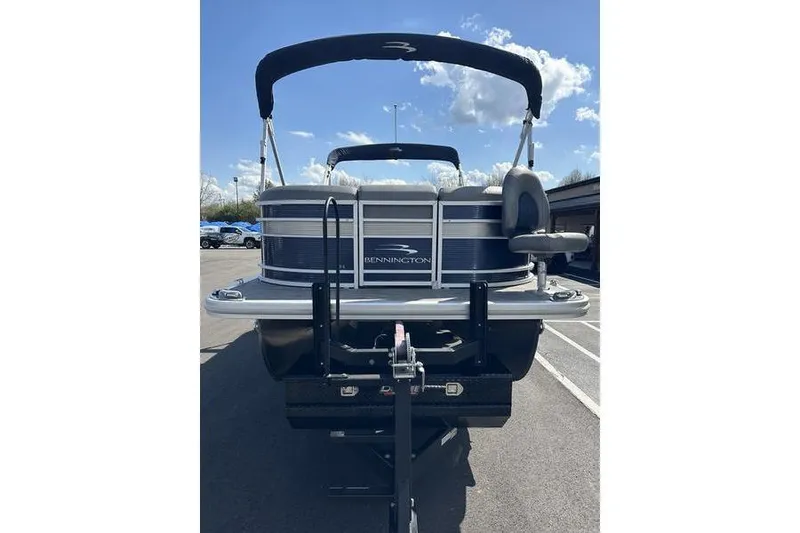 Slide: The Image of 2022 Bennington LPD boat dashboard with gauges and steering wheel. - 18