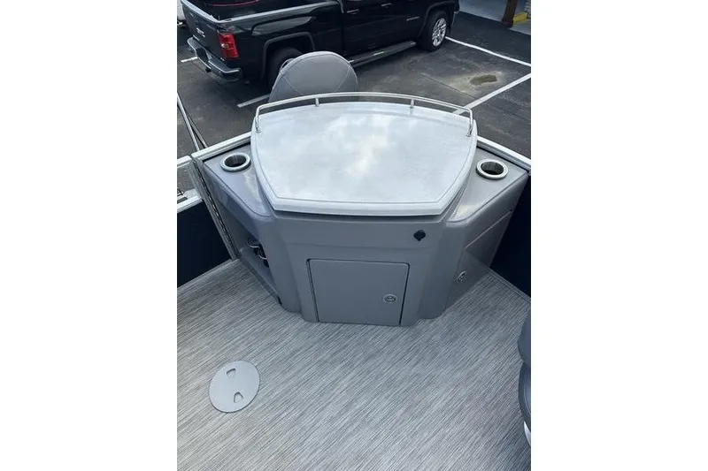 Slide: The Image of 2022 Bennington LPD pontoon boat on trailer under clear blue sky. - 3