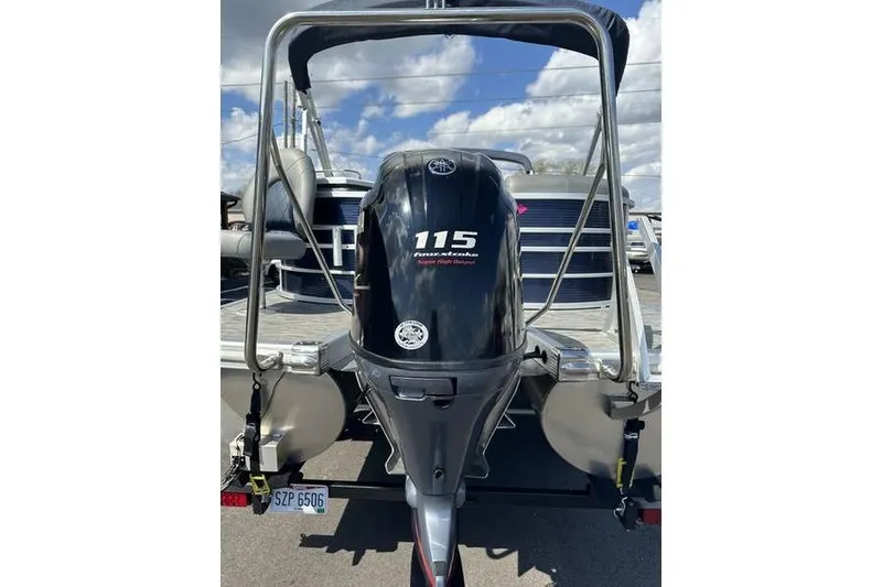 Slide: The Image of 2022 Bennington LPD boat with 115 horsepower outboard motor, rear view. - 5