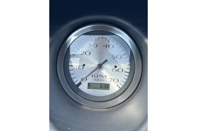 Slide: The Image of 2022 Bennington LPD pontoon boat on trailer under clear blue sky. - 8