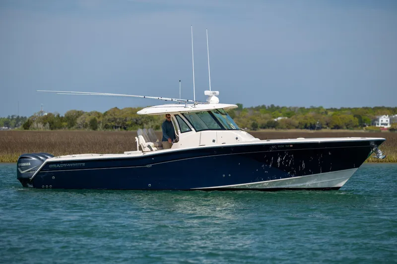 The Image of 2017 Grady-White Canyon 376 boat cruising on a calm waterway. - 0