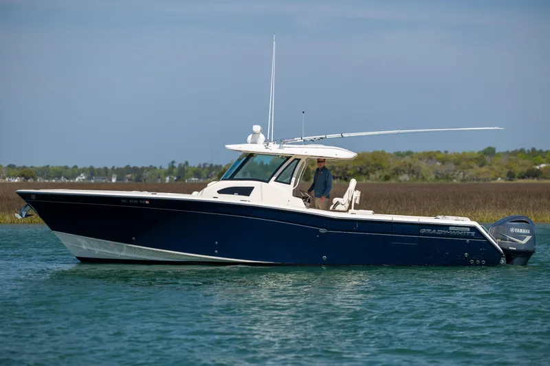 Slide: The Image of 2017 Grady-White Canyon 376 boat on water with Yamaha engines. - 11