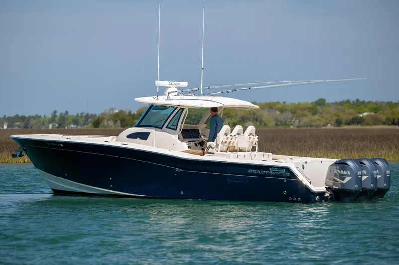 Slide: The Image of 2017 Grady-White Canyon 376 boat on water with Yamaha engines. - 12