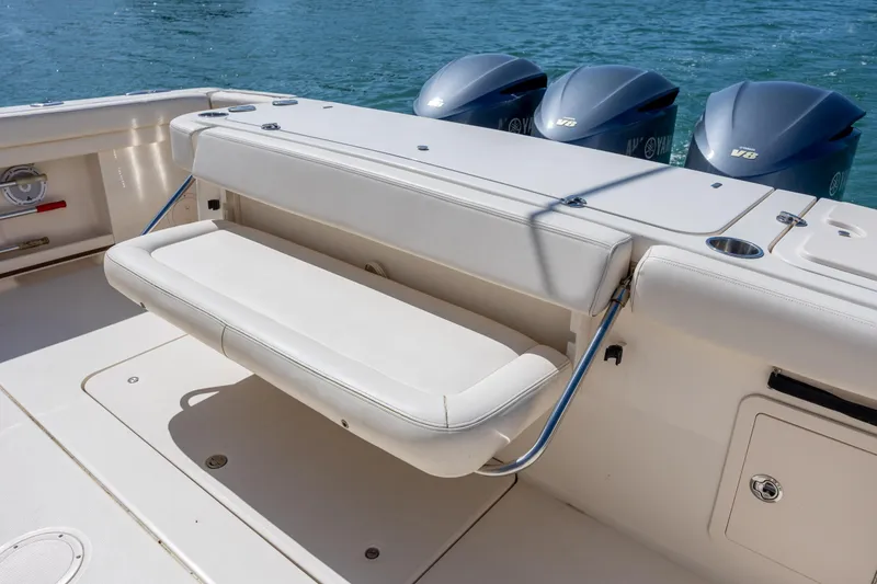 Slide: The Image of 2017 Grady-White Canyon 376 boat with foldable seating and triple Yamaha V6 engines. - 17