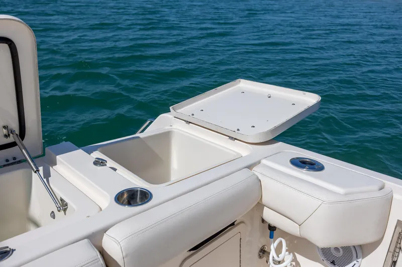 Slide: The Image of 2017 Grady-White Canyon 376 boat deck with storage compartments and ocean view. - 19