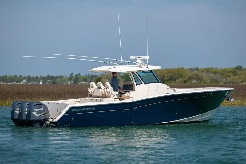 Slide: The Image of 2017 Grady-White Canyon 376 boat with Yamaha engines on calm water. - 3