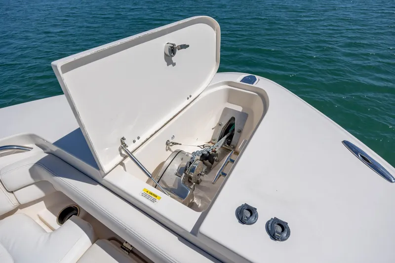 Slide: The Image of Open anchor compartment on 2017 Grady-White Canyon 376 boat, with ocean background. - 32