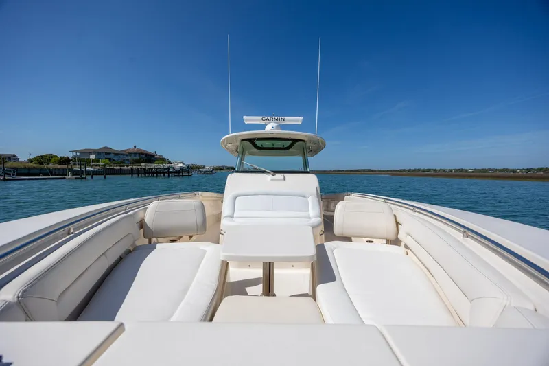 Slide: The Image of 2017 Grady-White Canyon 376 boat with spacious seating on calm water. - 33