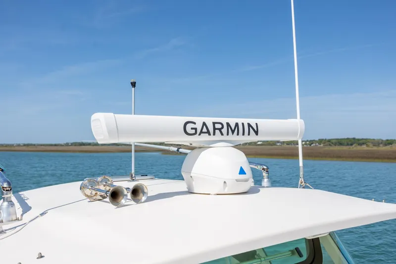 Slide: The Image of 2017 Grady-White Canyon 376 boat with Garmin radar on top. - 34