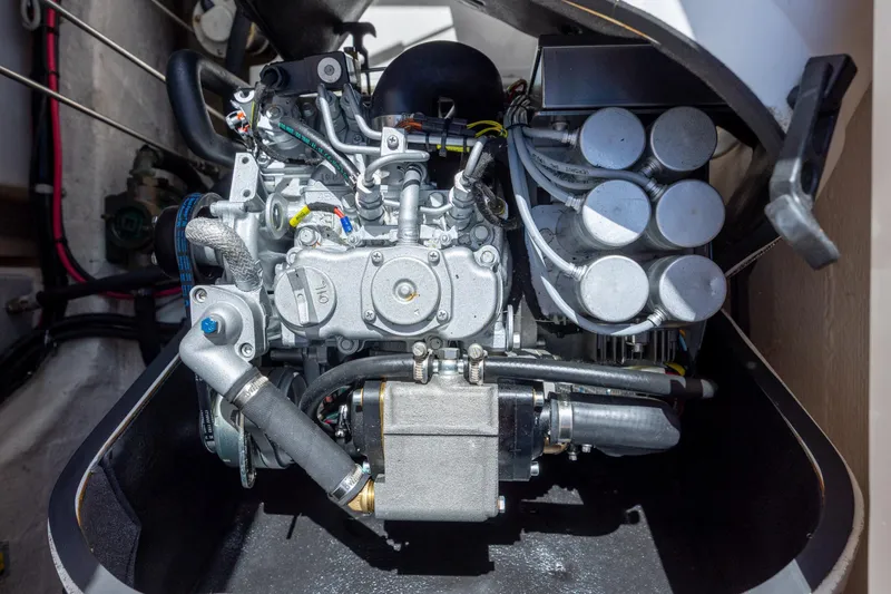 Slide: The Image of Engine compartment of a 2017 Grady-White Canyon 376 boat, showcasing mechanical components. - 49