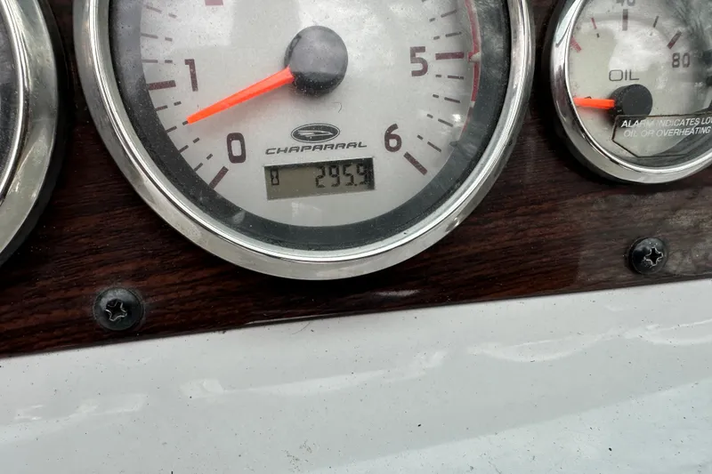 Slide: The Image of Close-up of 2005 Chaparral Sunesta 216 dashboard gauges, showing RPM and oil indicators. - 12