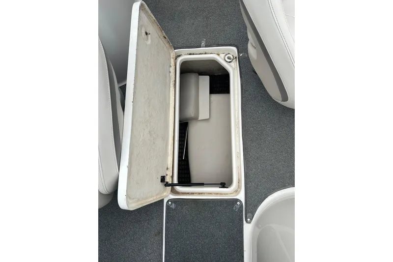Slide: The Image of Open storage compartment in 2005 Chaparral Sunesta 216 boat interior. - 18