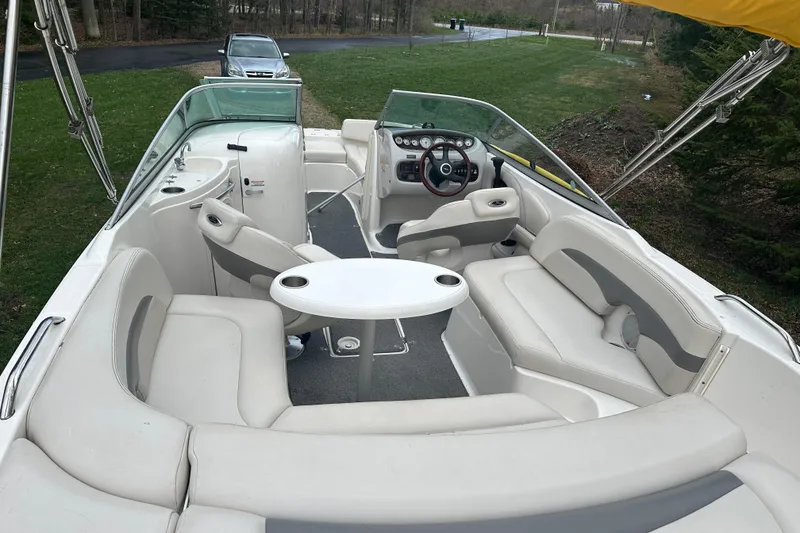 Slide: The Image of 2005 Chaparral Sunesta 216 boat interior with seating and steering wheel. - 20