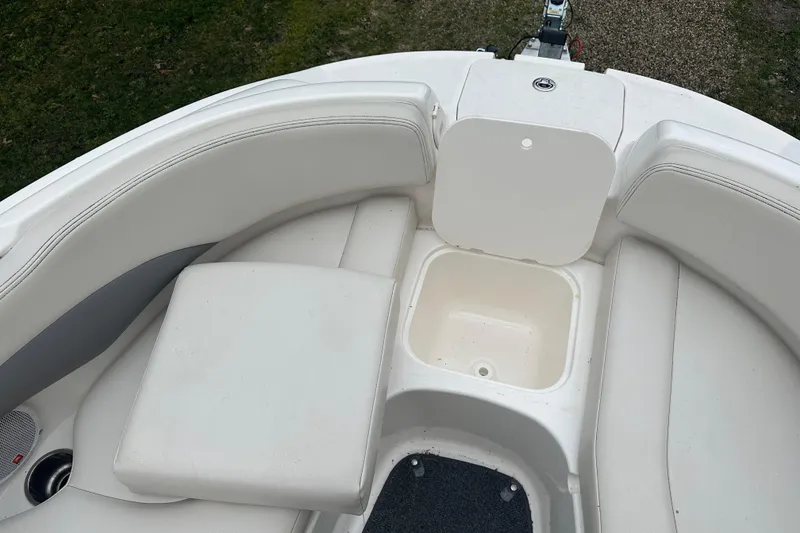 Slide: The Image of Interior of a 2005 Chaparral Sunesta 216 boat with white upholstery. - 6