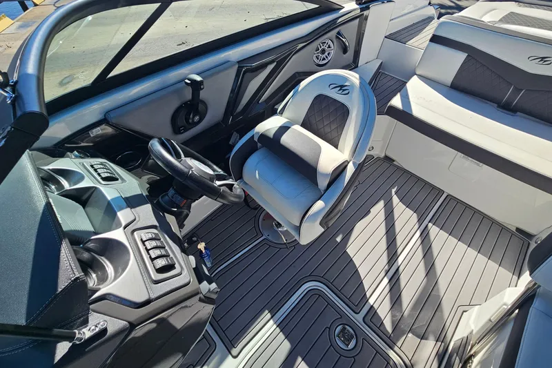 Slide: The Image of Interior of a 2017 Monterey 238SS Super Sport boat with sleek seating and controls. - 10