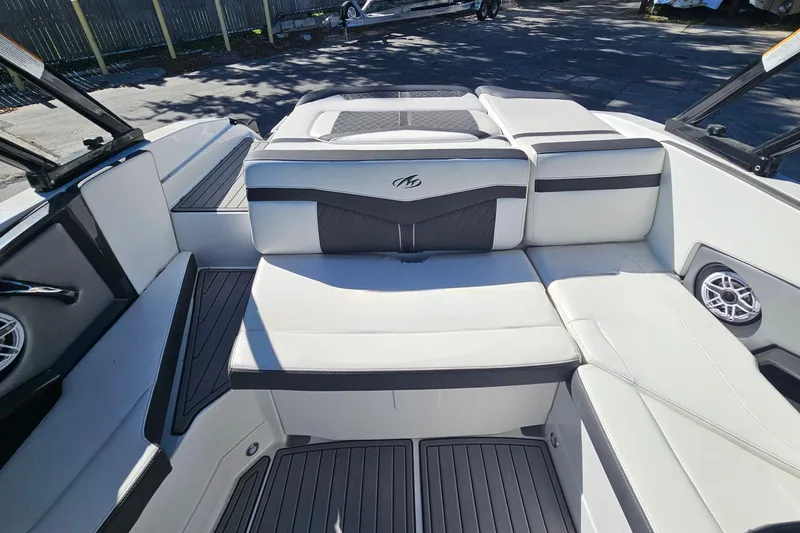 Slide: The Image of 2017 Monterey 238SS Super Sport boat interior with white and black seating. - 14
