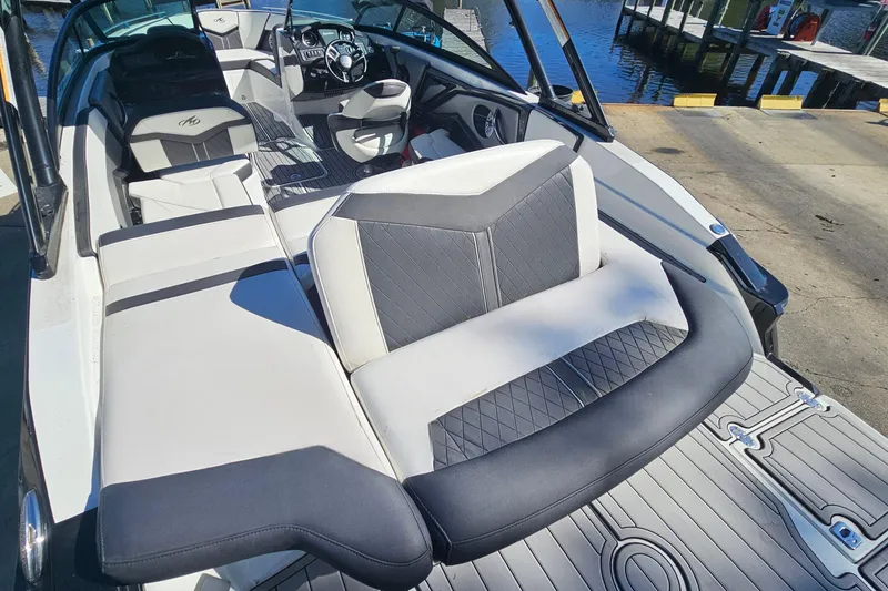 Slide: The Image of 2017 Monterey 238SS Super Sport boat interior with luxurious seating and modern dashboard. - 18