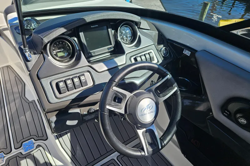 Slide: The Image of 2017 Monterey 238SS Super Sport boat dashboard with steering wheel and controls. - 19