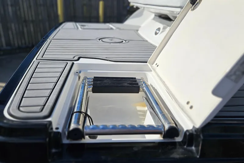 Slide: The Image of 2015 Monterey 238SS Super Sport boat with integrated swim ladder on deck. - 22