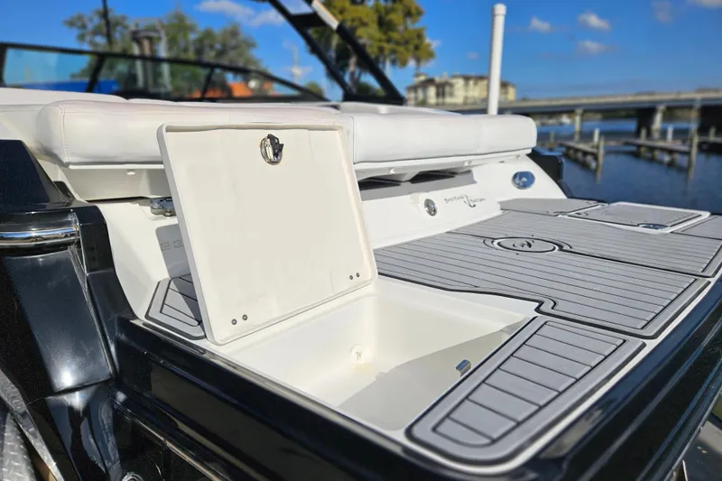 Slide: The Image of 2015 Monterey 238SS Super Sport boat with open storage compartment on deck. - 23