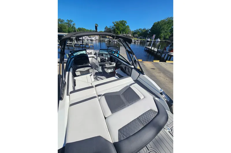 Slide: The Image of 2017 Monterey 238SS Super Sport boat interior at dock, featuring sleek seating and modern design. - 6