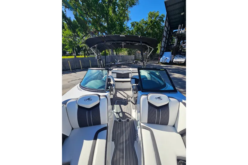 Slide: The Image of 2017 Monterey 238SS Super Sport boat interior with sleek seating and canopy. - 8