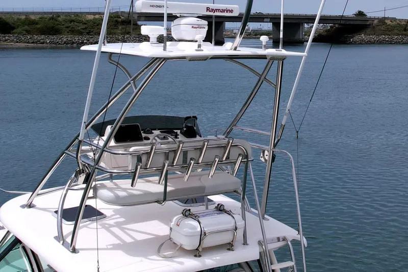 Slide: The Image of 2012 Pursuit OS 345 Offshore boat with radar and fishing rod holders. - 3