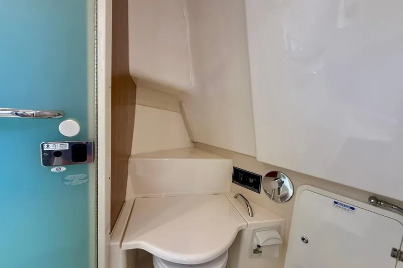 Slide: The Image of Interior of 2012 Pursuit OS 345 Offshore boat bathroom with modern fixtures. - 37