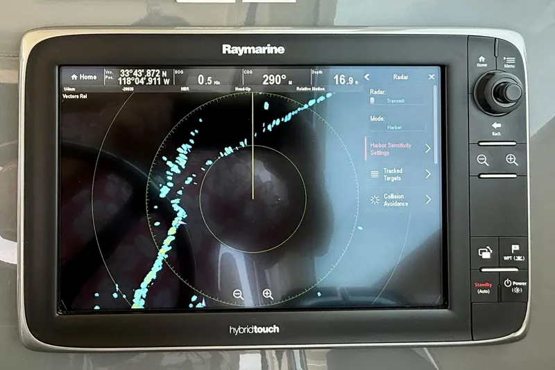 Slide: The Image of Raymarine radar display on 2012 Pursuit OS 345 Offshore boat, showing navigation data. - 43