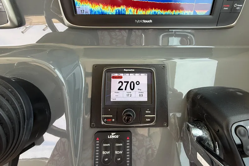 Slide: The Image of Control panel of a 2012 Pursuit OS 345 Offshore boat with navigation display. - 46