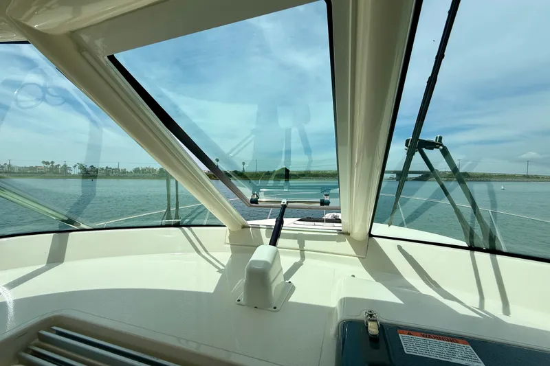 Slide: The Image of 2012 Pursuit OS 345 Offshore boat interior with clear view of water and sky. - 51