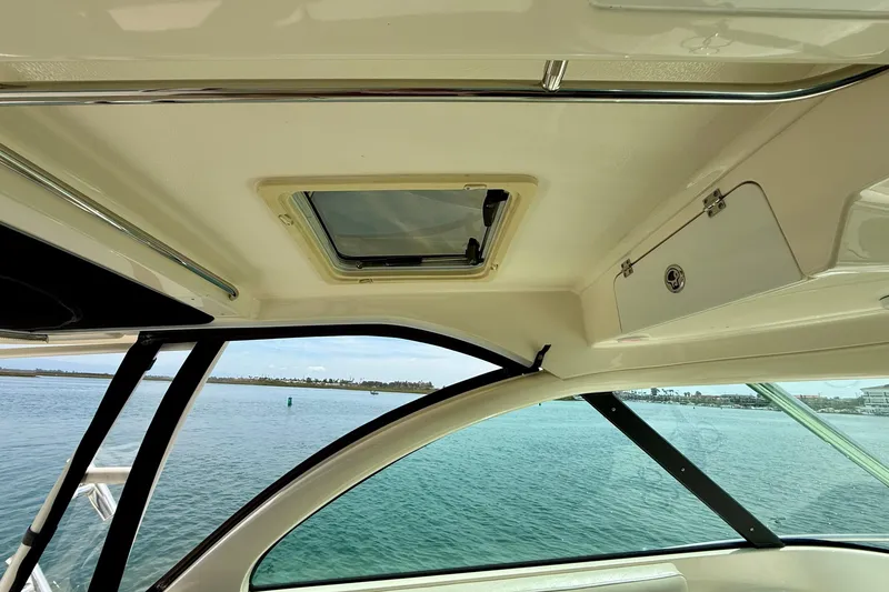 Slide: The Image of Interior view of 2012 Pursuit OS 345 Offshore boat with ocean backdrop. - 54