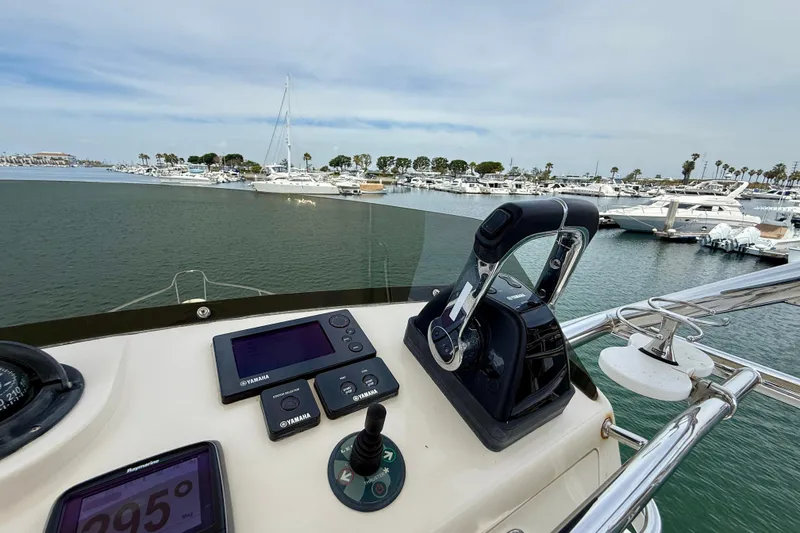Slide: The Image of Helm of 2012 Pursuit OS 345 Offshore boat with Yamaha controls in marina. - 74