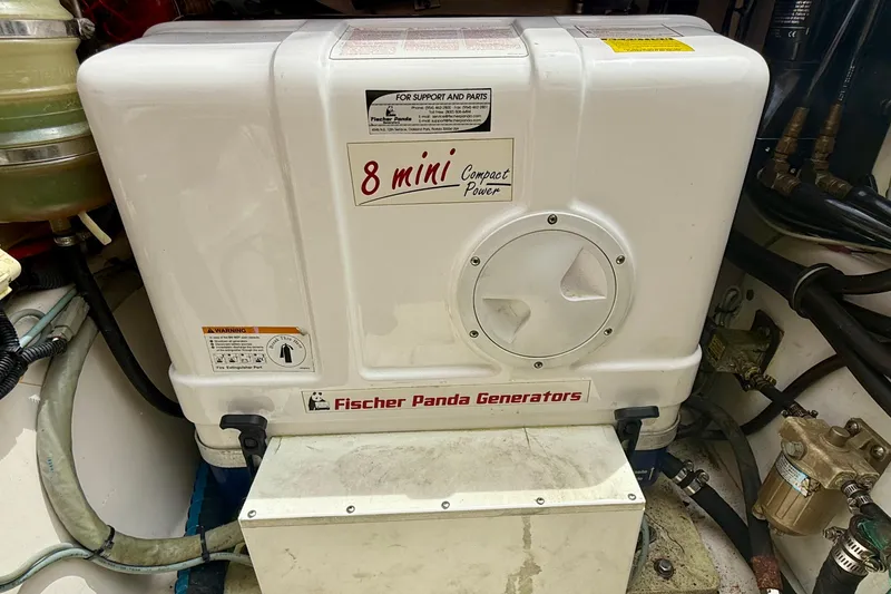 Slide: The Image of Fischer Panda generator in a 2012 Pursuit OS 345 Offshore boat engine room. - 90