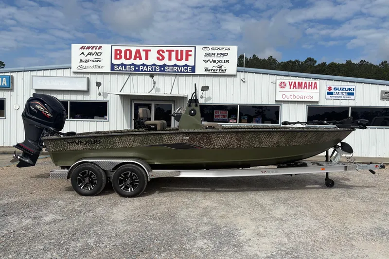 The Image of 2026 Vexus ACX 2210 boat on trailer outside dealership, featuring Yamaha outboard motor. - 1