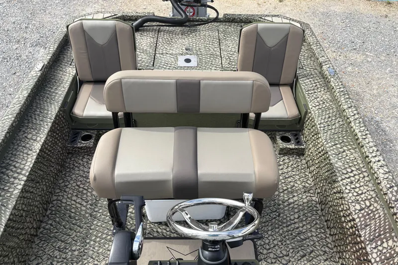 Slide: The Image of 2026 Vexus ACX 2210 boat interior with patterned flooring and beige seating. - 10