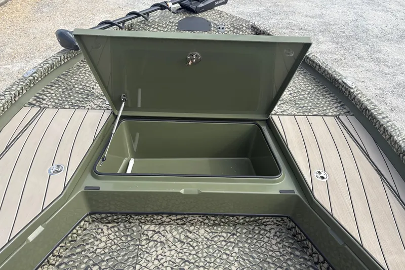 Slide: The Image of Open storage compartment on 2026 Vexus ACX 2210 boat with textured flooring. - 11