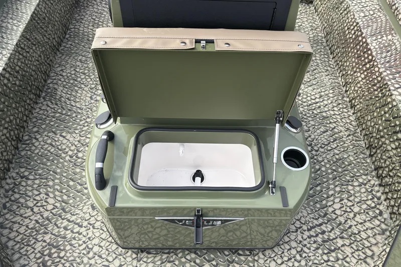 Slide: The Image of Open storage compartment on 2026 Vexus ACX 2210 boat with textured flooring. - 12