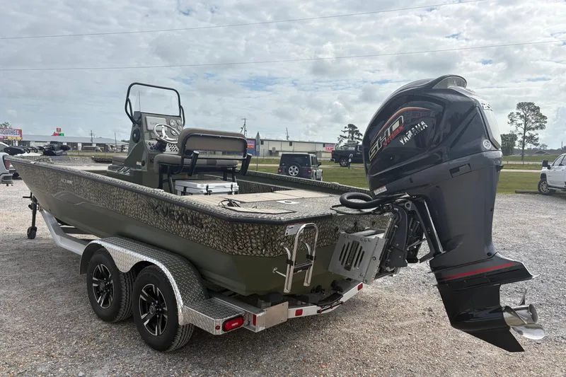 Slide: The Image of 2026 Vexus ACX 2210 boat with Yamaha engine on a trailer, parked outdoors. - 3