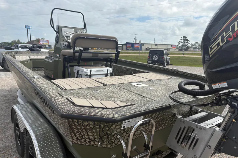 Slide: The Image of 2026 Vexus ACX 2210 boat with camouflage design and powerful outboard motor. - 5