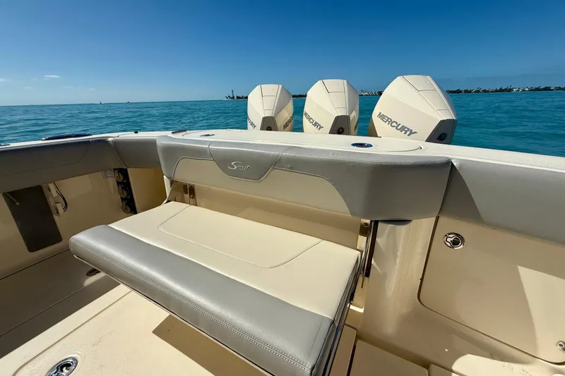 Slide: The Image of 2019 Scout 355 LXF boat with Mercury engines on a sunny day at sea. - 13