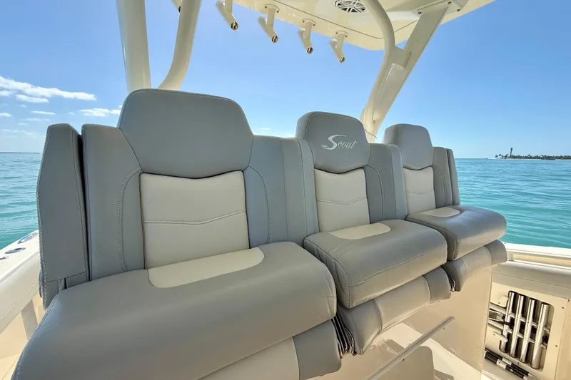 Slide: The Image of 2019 Scout 355 LXF boat seats with ocean view and clear sky. - 18