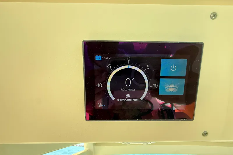 Slide: The Image of Seakeeper control panel on 2019 Scout 355 LXF boat, displaying roll angle and voltage. - 21