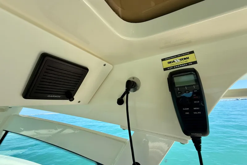 Slide: The Image of 2019 Scout 355 LXF boat with Garmin marine electronics and Sea Tow sticker. - 23